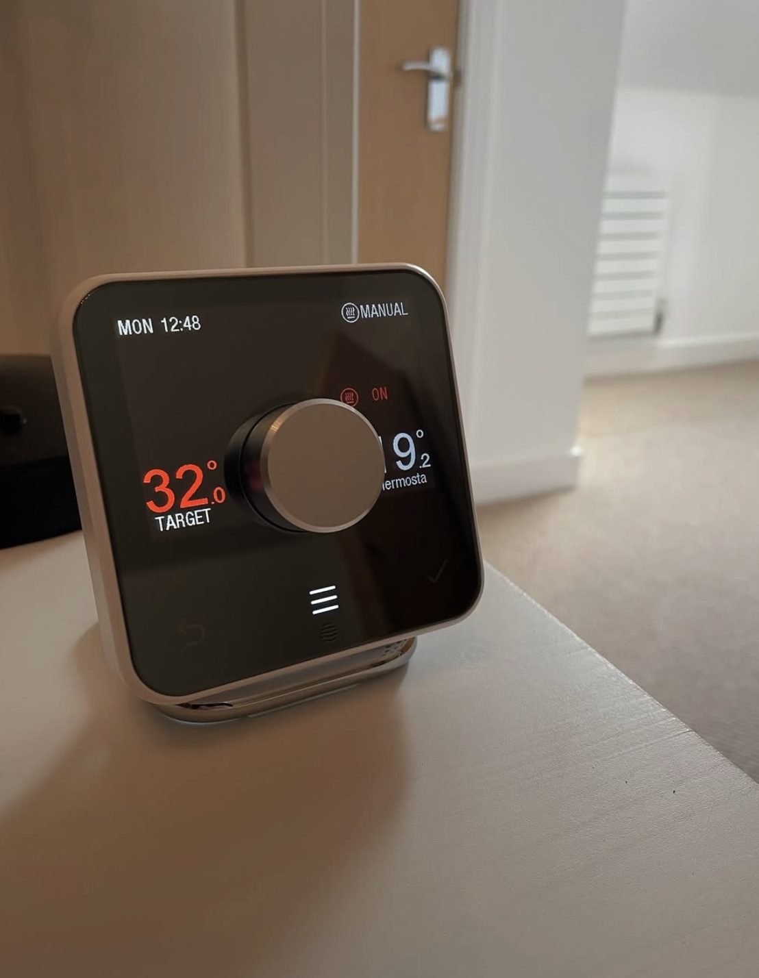 Smart heating thermostat showing a target temperature